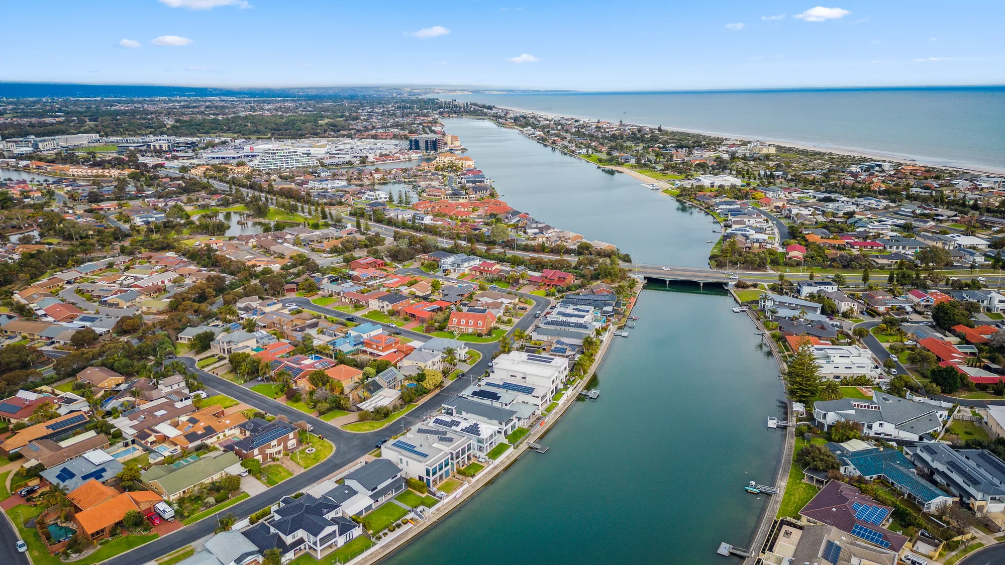 Aerial view along the West Lakes waterway to the coast