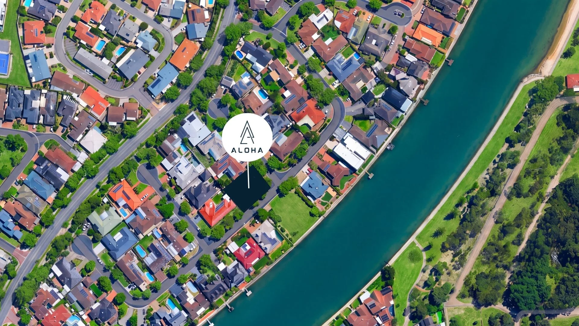 Aerial view of the Aloha Homes site at 1 Honolulu Grove, beside the West Lakes waterway